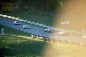 The pace car bunches up the field uphill into turn 6