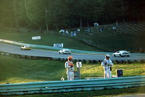 Shawn Hendricks' Chevy Corvette leads Bobby Carradine's Lotus Esprit X180R and Doc Bundy's Lotus Esprit X180R into turn 6