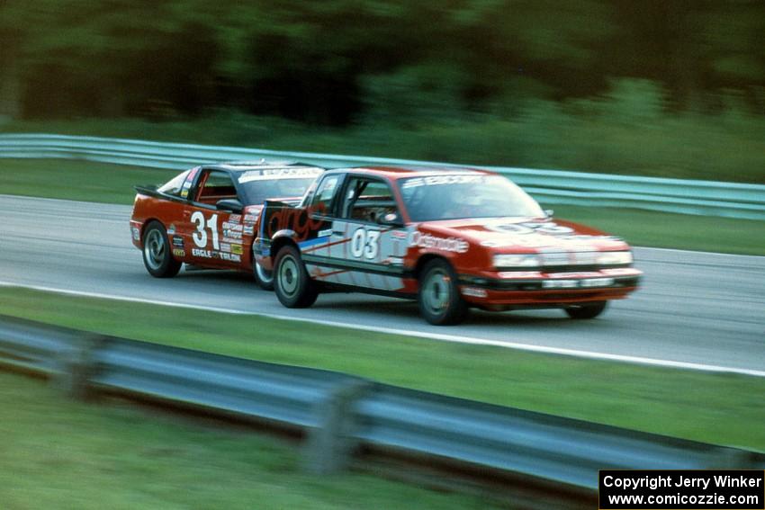 David Daughtery's Olds Quad 442 and Tommy Archer's Eagle Talon battle into turn 5