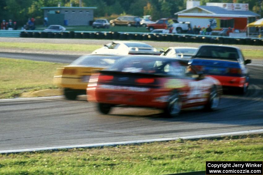 The two Lotus Esprit X180Rs of Doc Bundy and Bobby Carradine along with Shawn Hendricks' Chevy Corvette pass slower traffic