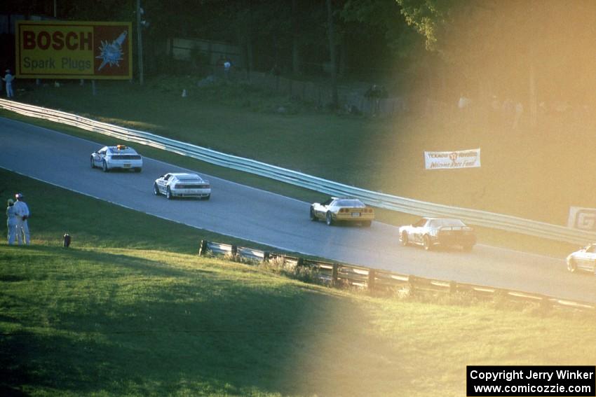 The pace car bunches up the field uphill into turn 6