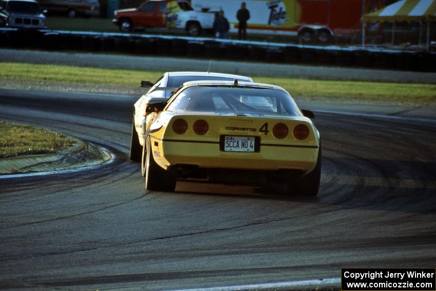 Bobby Carradine's Lotus Esprit X180R leads Shawn Hendricks' Chevy Corvette at turn 5