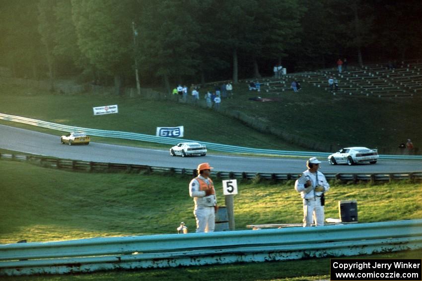 Shawn Hendricks' Chevy Corvette leads Bobby Carradine's Lotus Esprit X180R and Doc Bundy's Lotus Esprit X180R into turn 6