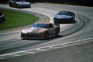 Scott Sharp's Chevy Camaro leads Darin Brassfield's and Chris Kneifel's Olds Cutlass Supremes