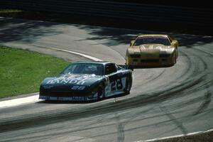 Jack Baldwin's Chevy Camaro ahead of Les Lindley's Chevy Camaro