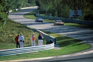 Scott Sharp's Chevy Camaro leads Darin Brassfield's Olds Cutlass Supreme into Canada Corner