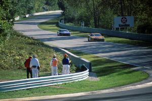 Scott Sharp's Chevy Camaro leads Darin Brassfield's Olds Cutlass Supreme into Canada Corner