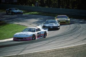 Steve Petty's Chevy Camaro and Irv Hoerr's Olds Cutlass Supreme ahead of the Chevy Camaros of Les Lindley and Jack Baldwin