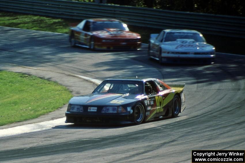 Phil Bartelt's Ford Mustang, Mitch Bender's Olds Cutlass Supreme and Don Sak's Olds Cutlass Supreme