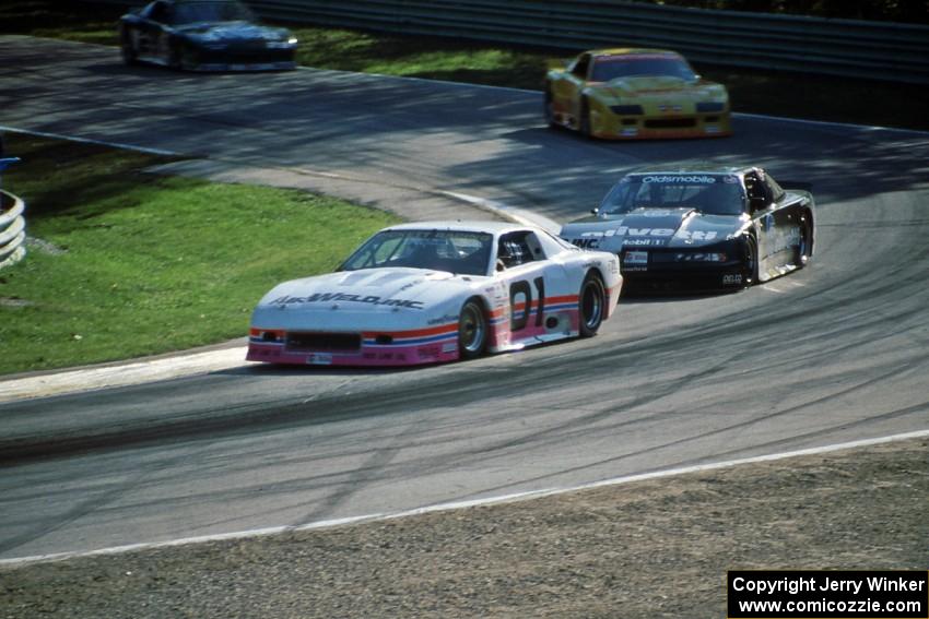 Steve Petty's Chevy Camaro and Irv Hoerr's Olds Cutlass Supreme ahead of the Chevy Camaros of Les Lindley and Jack Baldwin