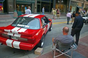 Mark Utecht relaxes next to the Ford Mustang he and Rob Bohn shared (1).