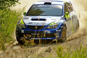 Travis Pastrana / Derek Ringer wring out their Subaru WRX STi on the practice stage.