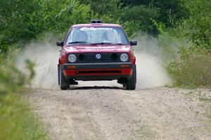 Daryn Chernick / Joe Czubaty come flying over a crest on the practice stage in their VW GTI.