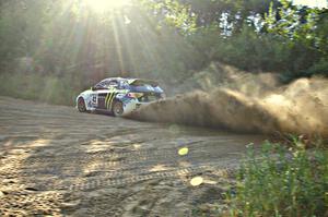 Ken Block / Alex Gelsomino fly through a fast right-hander on SS2 in their Subaru WRX STi.