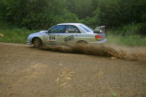 Piotr Wiktorczyk / Chrissie Beavis at speed through a right-hander on SS2 in their Subaru WRX STi.