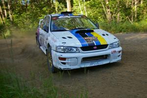 Kenny Bartram / Dennis Hotson prepare for a right-hander on SS2 in their Subaru Impreza.