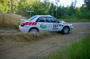 Dave Hintz / Rick Hintz throw up a huge plume of gravel on SS2 in their Subaru WRX.