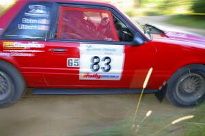 Mark Utecht / Rob Bohn drift their Ford Mustang through a 90-right on SS2.