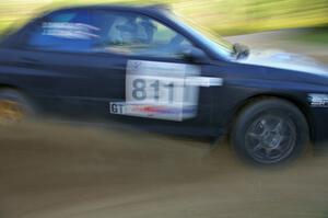 Jaroslaw Sozanski / Bartosz Sawicki sling gravel at a hard-right hander on SS2 in their Subaru WRX.