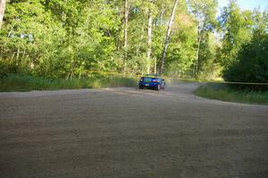 Heath Nunnemacher / Kim DeMotte overshoot the corner at a right-hander on SS2 in their Subaru WRX.