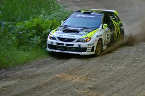 Ken Block / Alex Gelsomino get close to a swamp on the inside of a corner on SS3 in their Subaru WRX STi.