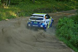 Travis Pastrana / Derek Ringer drift beautifully through a right-hander on SS3 in their Subaru WRX STi.