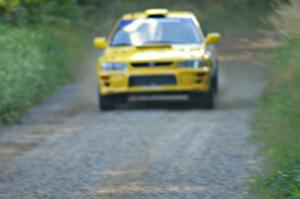 Kyle Sarasin / Mikael Johansson at speed down a straight in their Subaru Impreza on SS3.