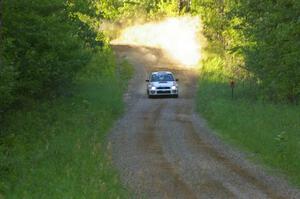 Dave Hintz / Rick Hintz at speed down a fast straight on SS3 in their Subaru WRX.