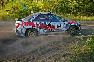 Robert Borowicz / Dave Parps drift through a right-hander on SS3 in their Subaru WRX.