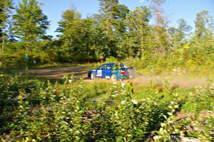 The George Georgakopoulos / Faruq Mays Subaru WRX prepares for a sharp right-hander on SS3.