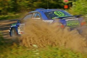Heath Nunnemacher / Kim DeMotte sling gravel at a right-hander on SS3 in their Subaru WRX.