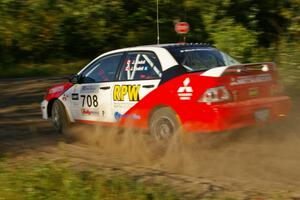 Jan Zedril / Jody Zedril prepare for a hard right-hander on SS3 in their Mitsubishi Lancer ES.