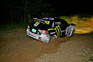 Ken Block / Alex Gelsomino at speed through a sweeper on SS5 in their Subaru WRX STi.