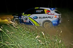 Travis Pastrana / Derek Ringer at a 90-left on SS6 in their Subaru WRX STi