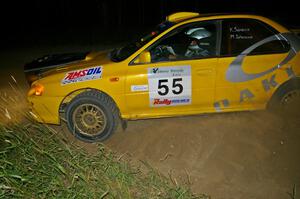 Kyle Sarasin / Mikael Johansson drift their Subaru Impreza through a left-hander on SS6.