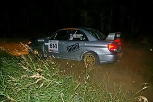 Piotr Wiktorczyk / Chrissie Beavis come out of a 90-left on SS6 in their Subaru WRX STi.