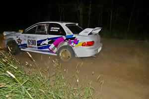 Kenny Bartram / Dennis Hotson blast away from a fast 90-left on SS6 in their Subaru Impreza.