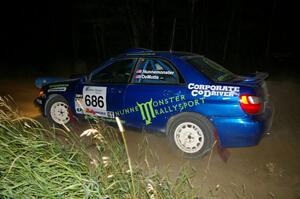 Heath Nunnemacher / Kim DeMotte drift through a left-hander on SS6 in their Subaru WRX.