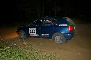 Paul Koll / Matt Wappler accelerate out of a left-hander in their VW Golf.