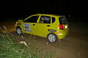 Jim Stevens / Marianne Stevens in their Suzuki Swift come out of a left-hander on SS6.