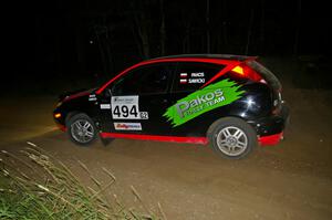 Roman Pakos / Maciej Sawicki exit a left-hander on SS6 in their Ford Focus SVT.