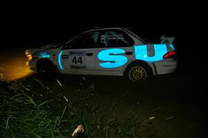 Henry Krolikowski / Cindy Krolikowski driving hard through a left-hander on SS6 in their Subaru Impreza.