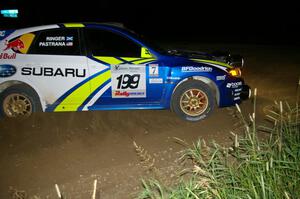 Travis Pastrana / Derek Ringer hard on the brakes at a hairpin on SS8 in their Subaru WRX STi.