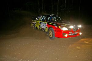 Andy Pinker / Robbie Durant set up for a right-hand hairpin on SS8 in their Subaru WRX STi.