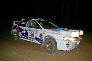 Kenny Bartram / Dennis Hotson prepare for a right-hand hairpin on SS8 in their Subaru Impreza.