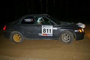 Jaroslaw Sozanski / Bartosz Sawicki drift wide out of a hairpin on SS8 in their Subaru WRX.