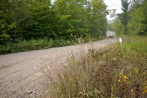 The Kyle Sarasin / Mikael Johansson Subaru Impreza rockets down a fast straight prior to a fast left-hander on SS10.