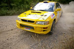 The Subaru Impreza of Kyle Sarasin / Mikael Johansson drift through a fast left-hander on SS10.