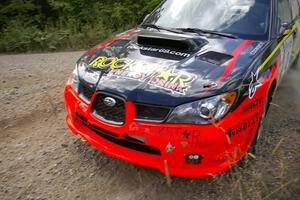 Andy Pinker / Robbie Durant at speed through a left sweeper on SS10 in their Subaru WRX STi.