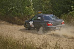 Jaroslaw Sozanski / Bartosz Sawicki exit out of a fast left-hander on SS10 in their Subaru WRX.